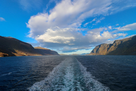 Wake after a cruise ship in the beautiful Hjorundfjorden fjord in More og Romsdal county in western Norway. 