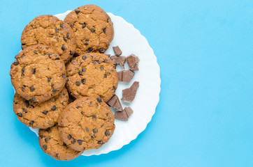 Cookies with chocolate on a blue background.