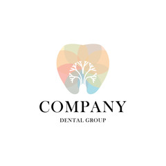 Logo with the image of a tooth in which a silhouette of a tree is carved.