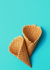 Empty waffle cup on blue backfround. 
