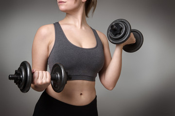 Fototapeta na wymiar fitness model on gray background