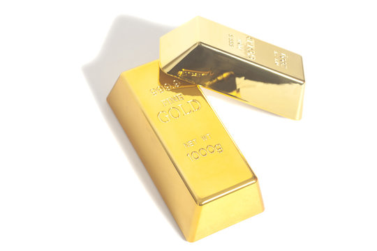 Gold bullion bars on white background