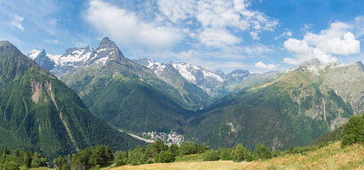 Mountain panorama . View of the mountain gorge and cable car in the distance mountain village