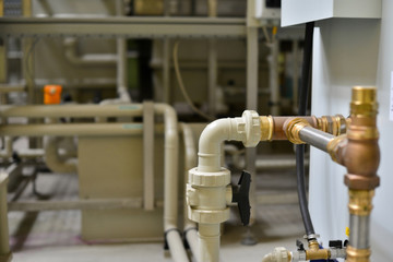 Brass, metal and plastic pipe joints under pressure at the station.