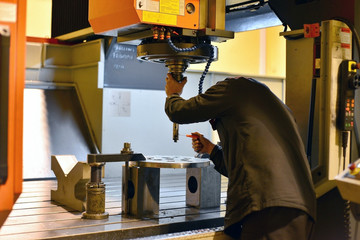 The cnc operator performs the replacement of the cutting tool