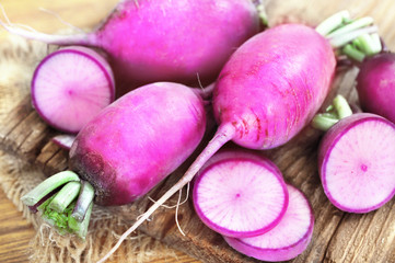 Fresh harvested red daikon radishes, selective focus, shallow DOF