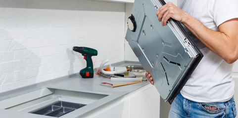 Installing new induction hob in modern kitchen