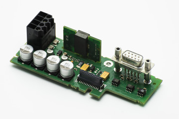 Integrated circuit with visible capacitors and VGA connector, isolated on a white background