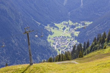 Chairlift with view into the valley, Montafon, Austria. Backlit Photograph
