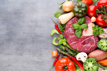 Raw fresh meat Ribeye Steak with vegetables and spice.
