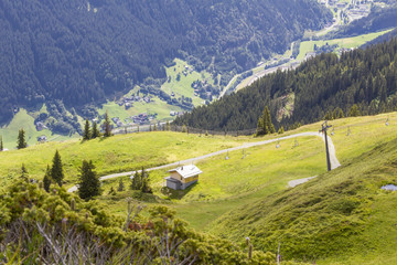 Chairlift with view into the valley, Montafon, Austria. Backlit Photograph