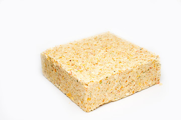 briquette of pea soup on white background