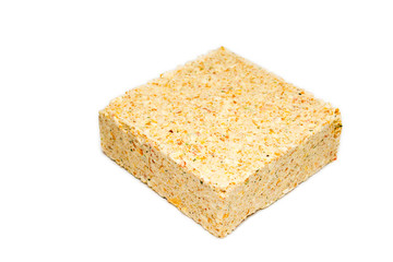 briquette of pea soup on white background