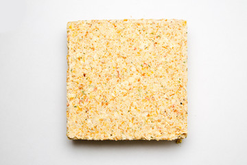 briquette of pea soup on white background