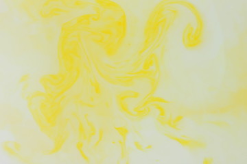 Abstract yellow background, pastel pattern, yellow paint in white liquid, stains on milk, art, minimalistic background, blank for designer, pop art, creative layout