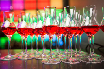 
Glass dishes in color lights background

