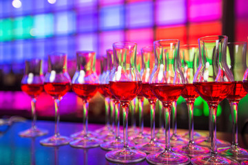 
Glass dishes in color lights background

