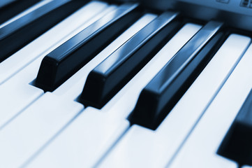 Piano keys toned,close-up. Side view. Electronic synthesizer.
