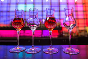 
Glass dishes in color lights background

