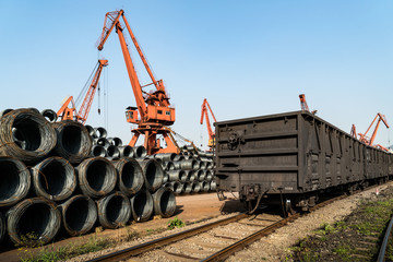 Fototapeta na wymiar Stacking steel and crane, in railway transportation