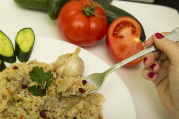tasty plov rice and meat with vegetables
