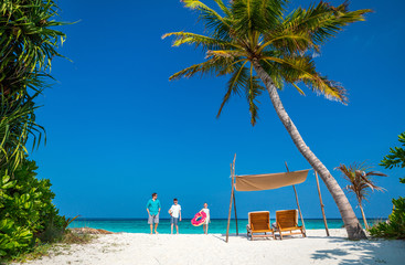 Father with kids at beach