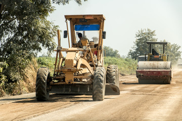 The construction machine is working on road surface repair. Construction of a road.