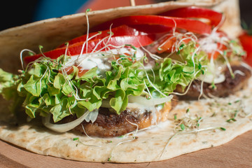 great mexican taco with meat schnitzel with cheese and vegetables