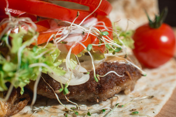 great mexican taco with meat schnitzel with cheese and vegetables