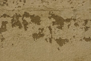 brown texture of an old grated concrete wall