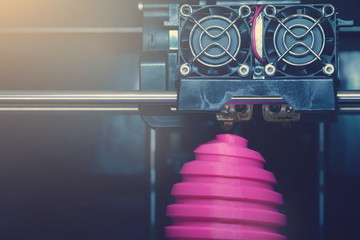FDM 3D-printer manufacturing wound pink easter egg sculpture - front view on object and print head - bright sunny matte look - background blanked out blurry