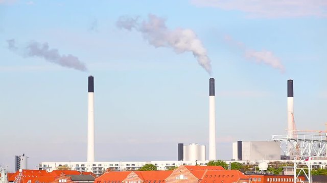Power plant with chimney stacksa and smoke in Copenhagen