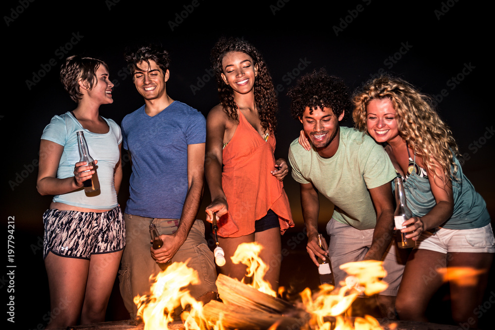 Wall mural Friends partying on the beach