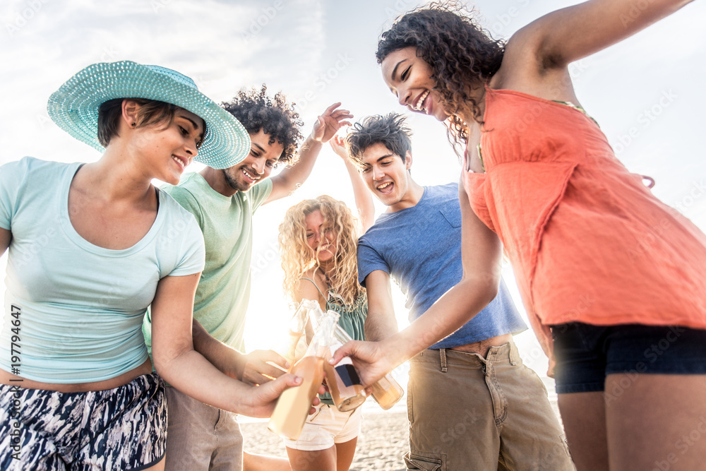 Wall mural Friends partying on the beach