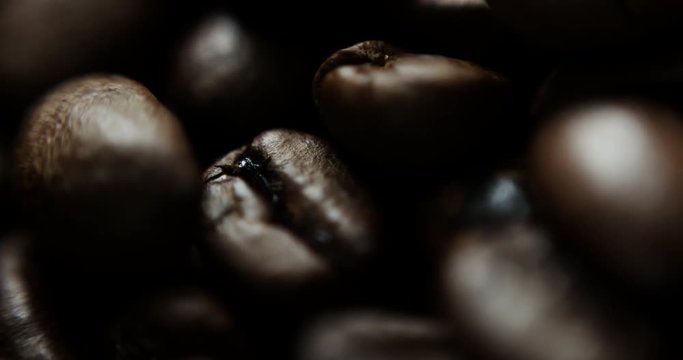 Closeup slow motion shot of roasted coffee beans
