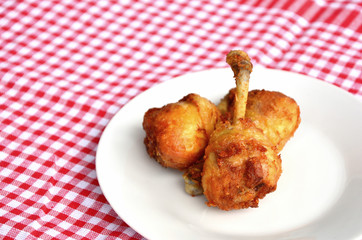 fried leg chicken menu for children with white dish