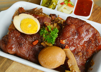 Braised pork leg or Thai style Stewed pork leg (Thai name is Kha Moo Pa Lo).
Pork leg street food menu in Thailand