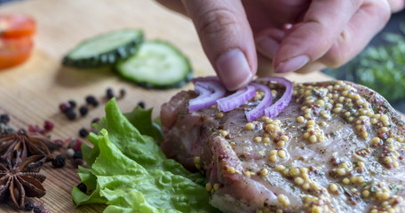 The process of cooking a steak, with all the ingredients on the table, selective focus