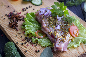 The process of cooking a steak, with all the ingredients on the table, selective focus