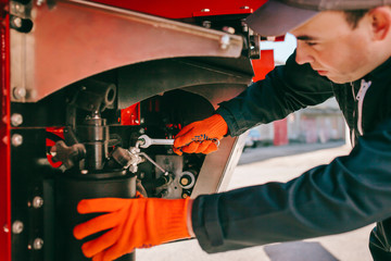 Mechanic in working overalls at work