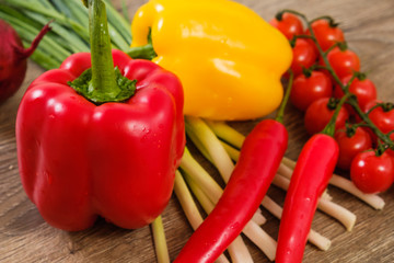 Ingredients vegetables for Burritos, tomatoes and peppers on wooden background. Top view