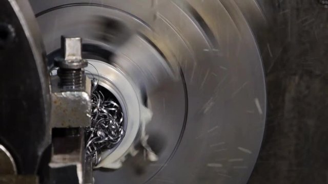 industrial metal work bore machining process by cutting tool on automated lathe