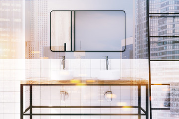 Gray tiled bathroom double sink close up toned