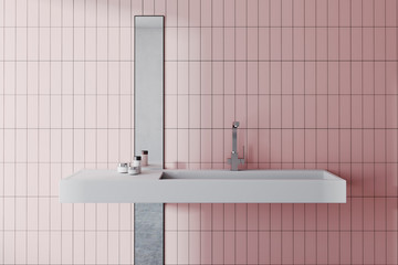 Sink in a pink bathroom interior