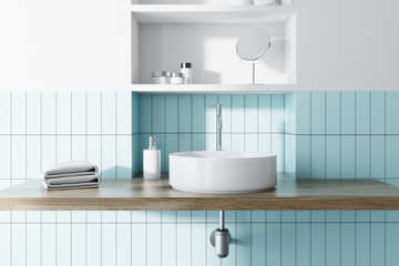 Sink in a blue and white bathroom interior