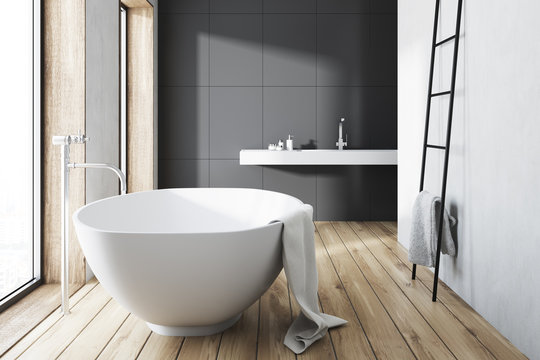 Gray bathroom, white tub, ladder