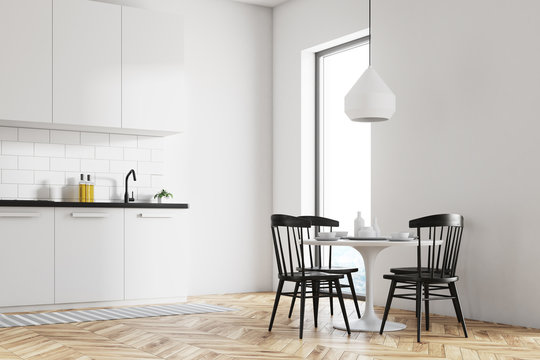 White dining room and kitchen corner