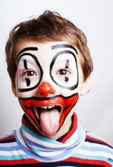 little cute real boy with facepaint like clown, pantomimic expre