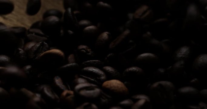 Closeup slow motion shot of roasted coffee beans