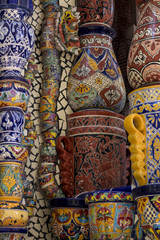Fototapeta premium Mexican talavera style pottery used in altar and fountain. This colorful handmade maiolica have a blurred appearance as they fuse slightly into the glaze. Vibrant colors and unique designs in each one